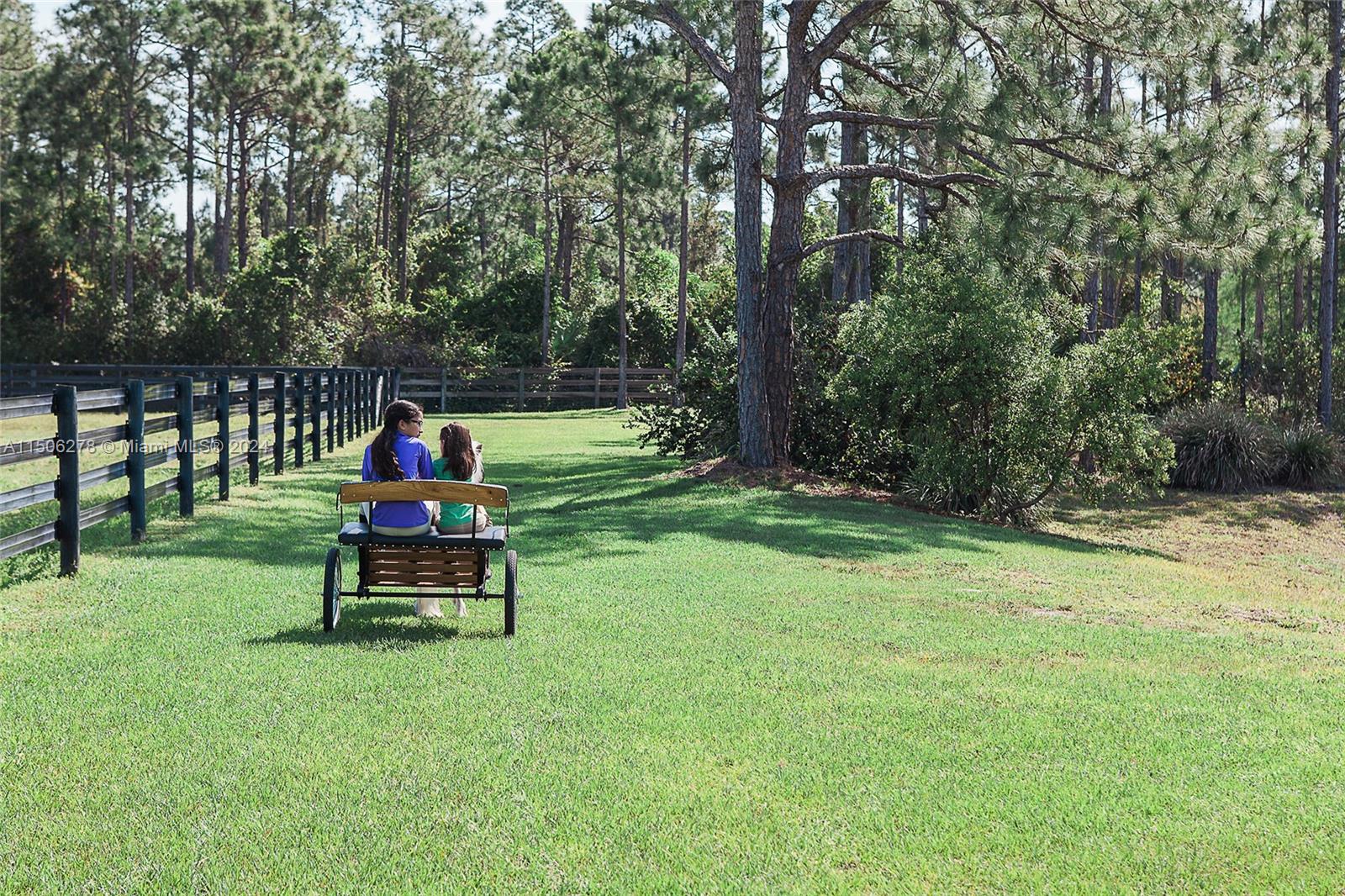 1500 Southeast Ranch Road South Jupiter, FL 33478 - Photo 17 of 29 a view of a park with chair and wooden fence