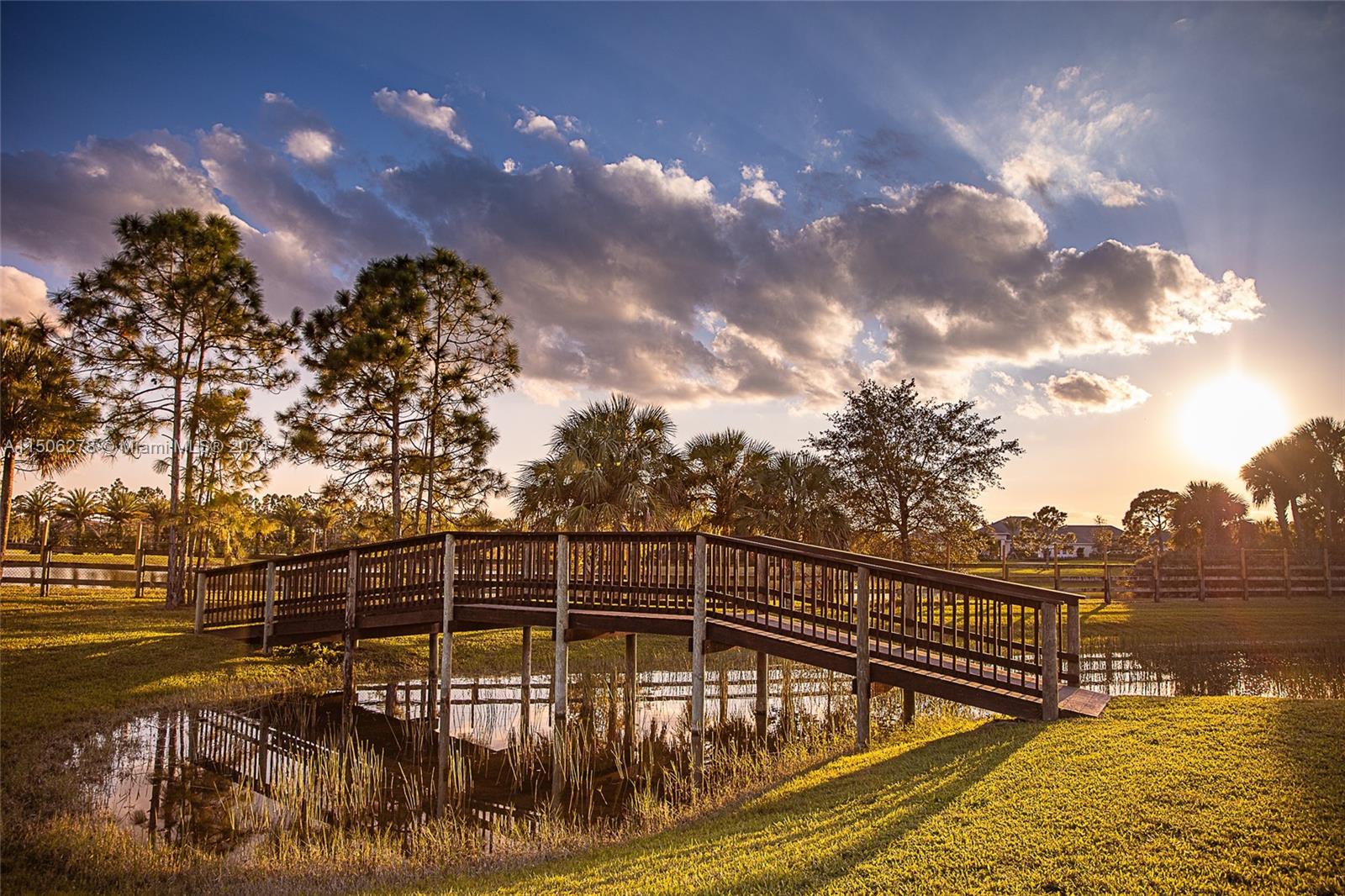 1500 Southeast Ranch Road South Jupiter, FL 33478 - Photo 24 of 29 a view of a swimming pool with outdoor seating and plants