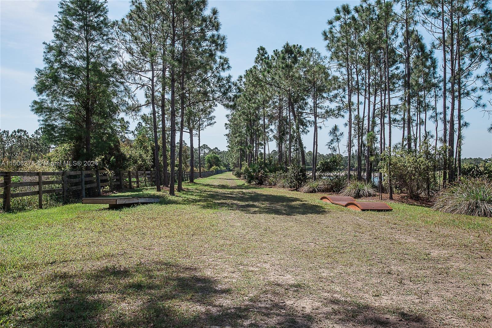 1500 Southeast Ranch Road South Jupiter, FL 33478 - Photo 29 of 29 a view of backyard with large trees
