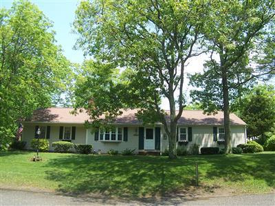 20 Chappaquiddick Road Centerville, MA 02632 - Photo 1 of 22 a front view of a house with a garden