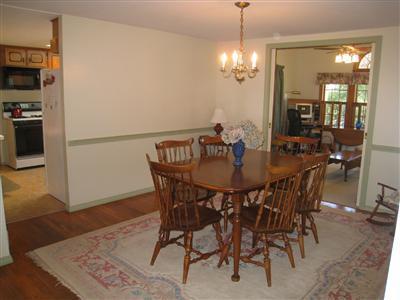 20 Chappaquiddick Road Centerville, MA 02632 - Photo 11 of 22 a view of a dining room with furniture and wooden floor