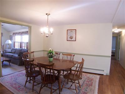 20 Chappaquiddick Road Centerville, MA 02632 - Photo 12 of 22 a view of a dining room with furniture and wooden floor