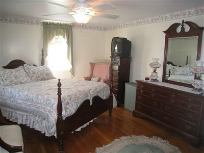 20 Chappaquiddick Road Centerville, MA 02632 - Photo 16 of 22 a bedroom with a bed and a mirror on dresser