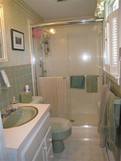 20 Chappaquiddick Road Centerville, MA 02632 - Photo 18 of 22 a bathroom with a sink a toilet and shower