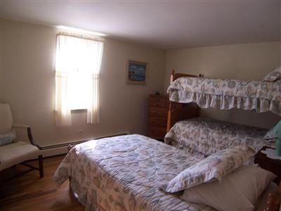 20 Chappaquiddick Road Centerville, MA 02632 - Photo 20 of 22 a bedroom with a bed and a window