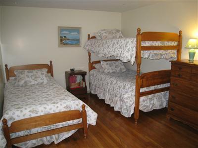 20 Chappaquiddick Road Centerville, MA 02632 - Photo 21 of 22 a bedroom with bed and wooden floor