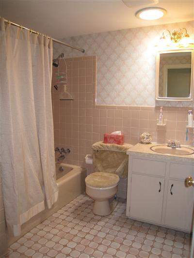 20 Chappaquiddick Road Centerville, MA 02632 - Photo 22 of 22 a bathroom with a granite countertop toilet a sink and a mirror