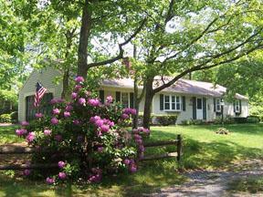 20 Chappaquiddick Road Centerville, MA 02632 - Photo 3 of 22 a front view of a house with a yard and potted plants