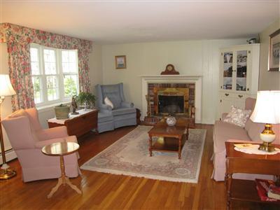 20 Chappaquiddick Road Centerville, MA 02632 - Photo 9 of 22 a living room with furniture and a fireplace