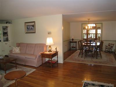 20 Chappaquiddick Road Centerville, MA 02632 - Photo 10 of 22 a living room with furniture dining table and a large window