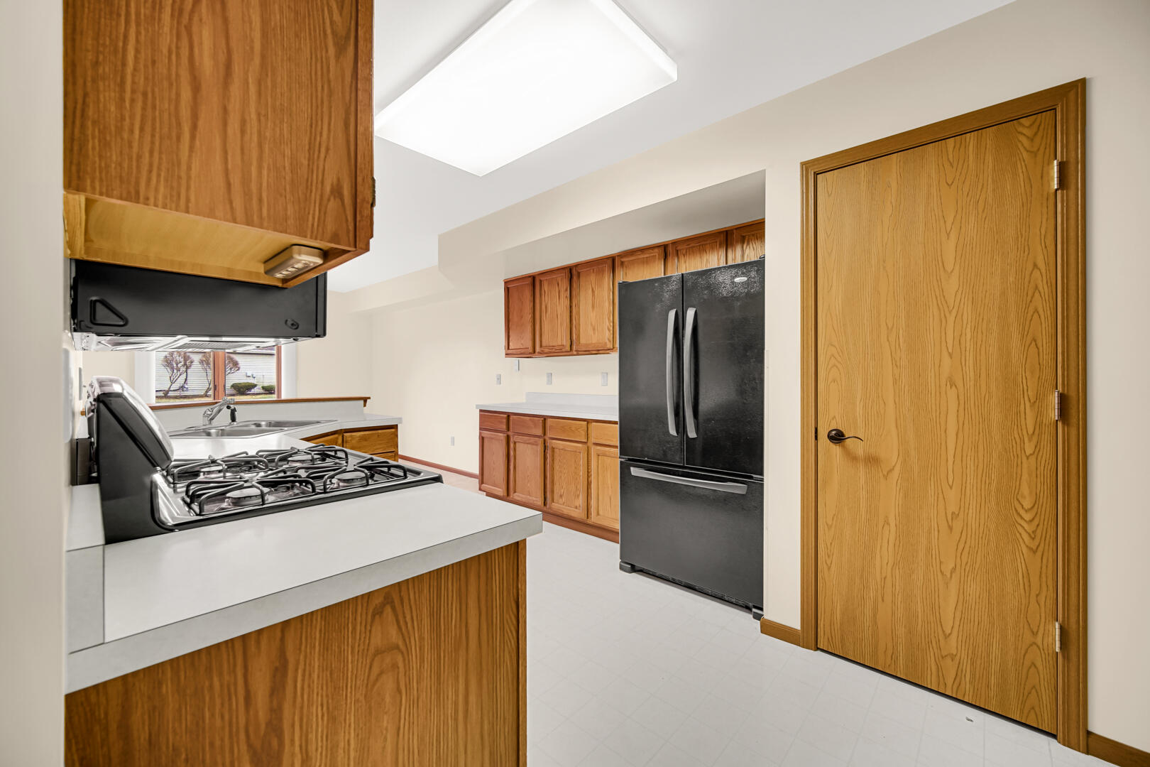 633 West 94th Court Crown Point, IN 46307 - Photo 13 of 29 a kitchen with stainless steel appliances granite countertop a refrigerator and a stove