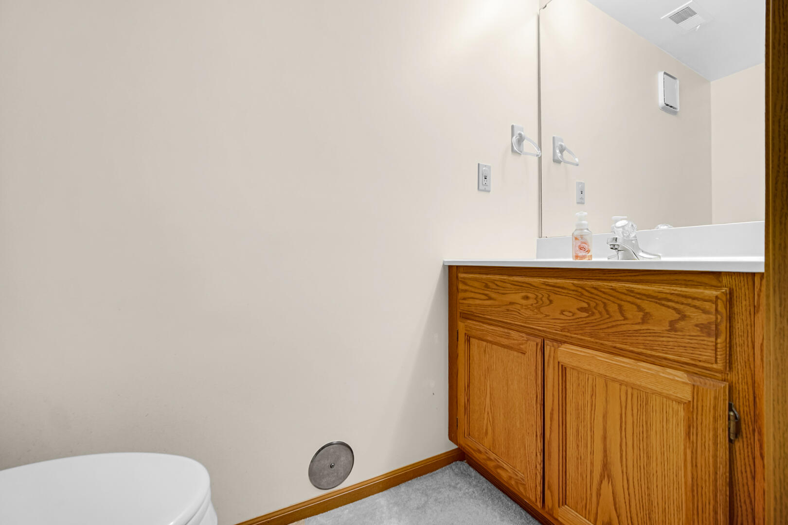 633 West 94th Court Crown Point, IN 46307 - Photo 17 of 29 a bathroom with a sink a toilet and mirror