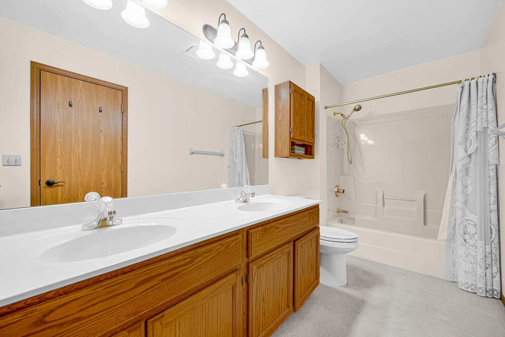 633 West 94th Court Crown Point, IN 46307 - Photo 22 of 29 a bathroom with a sink a toilet and shower