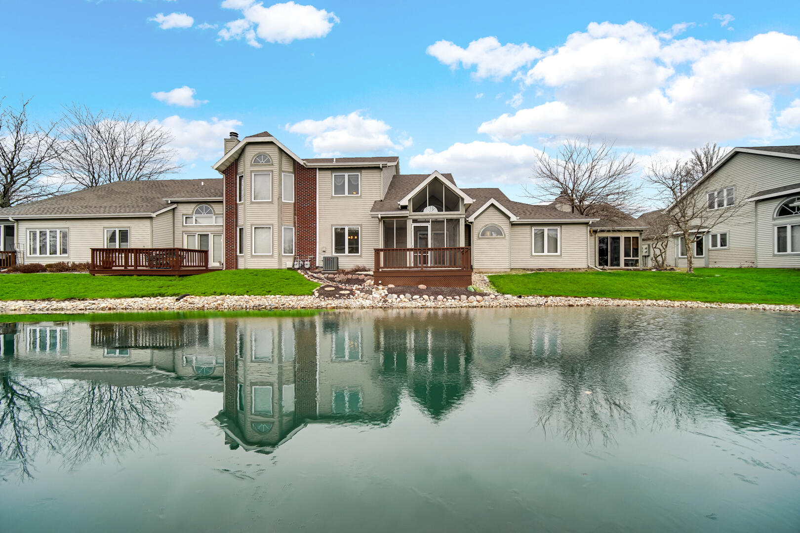 633 West 94th Court Crown Point, IN 46307 - Photo 25 of 29 a front view of a house with a lake view