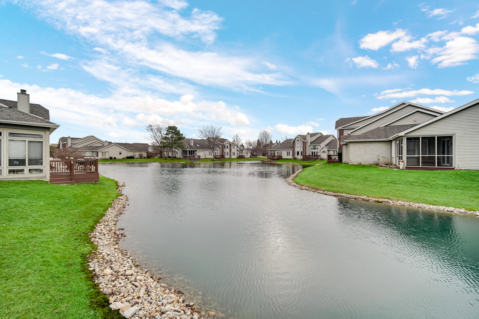 633 West 94th Court Crown Point, IN 46307 - Photo 27 of 29 a view of a lake with houses in the back