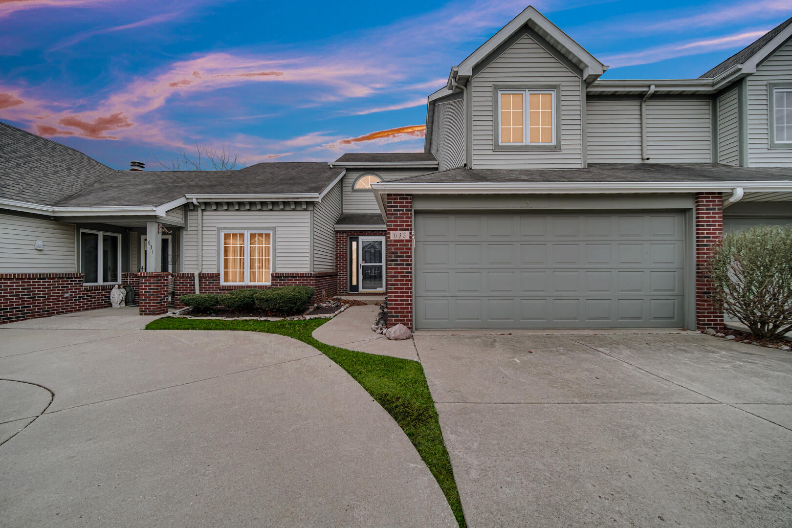 633 West 94th Court Crown Point, IN 46307 - Photo 3 of 29 a front view of a house with a yard and garage