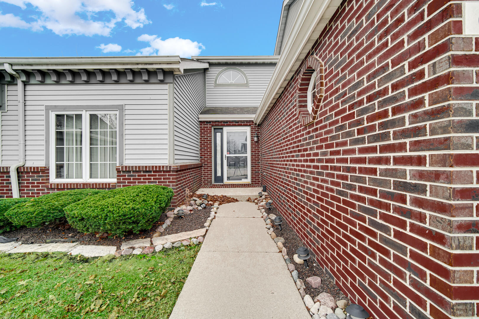 633 West 94th Court Crown Point, IN 46307 - Photo 5 of 29 a pathway of a house with a yard