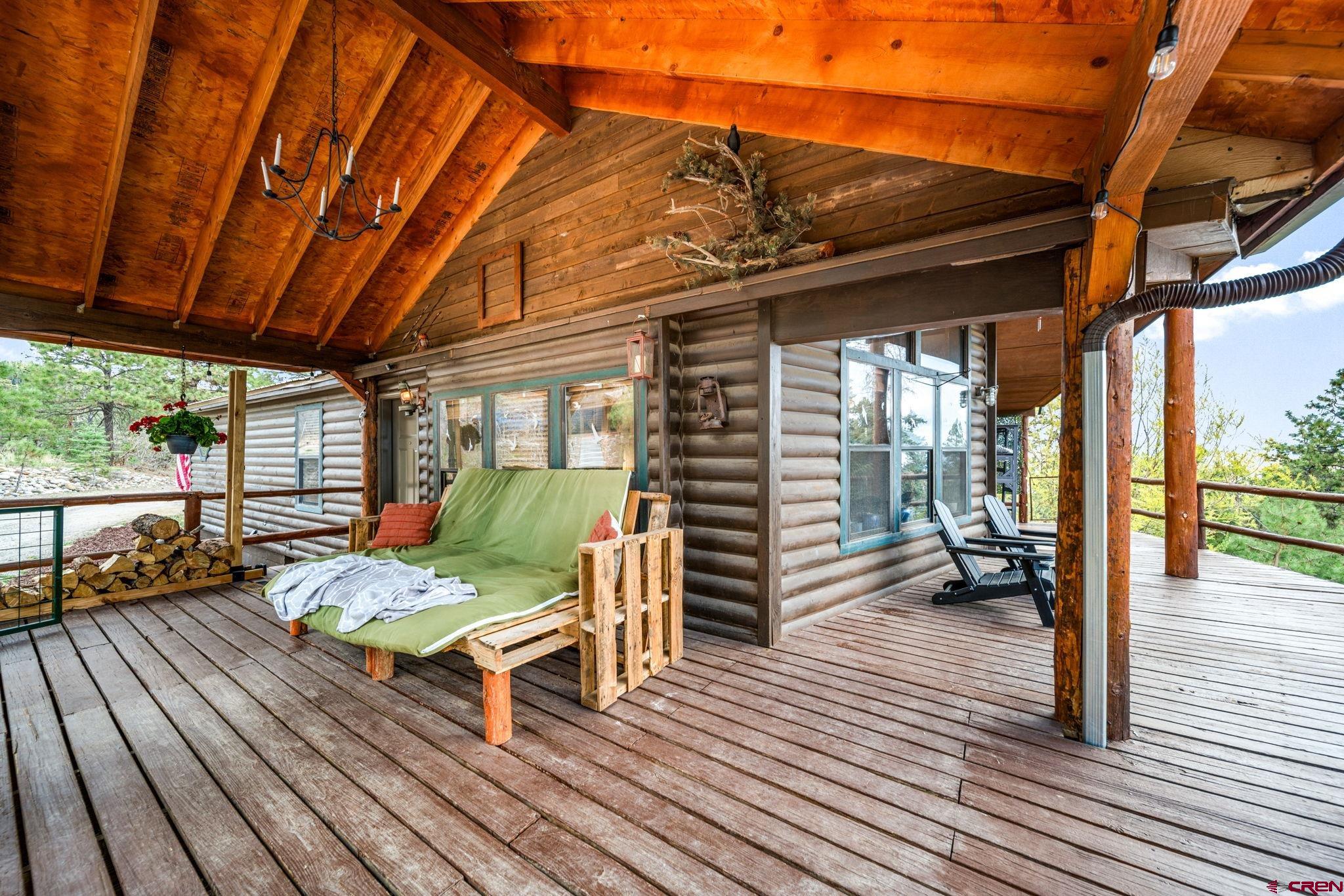 1118 Durango Road Durango, CO 81301 - Photo 12 of 32 a balcony with furniture and wooden floor