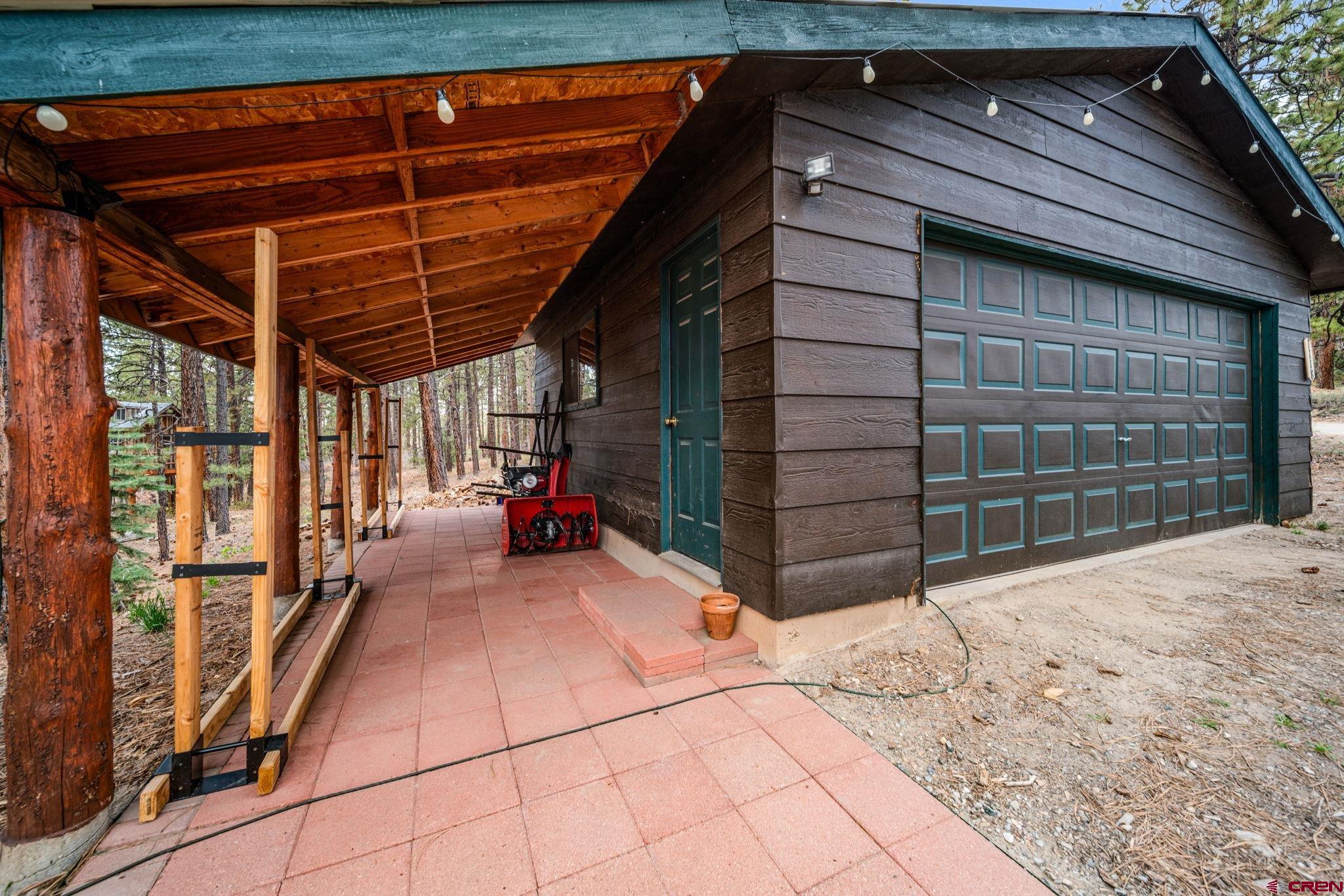 1118 Durango Road Durango, CO 81301 - Photo 15 of 32 a view of a car garage both side of a house