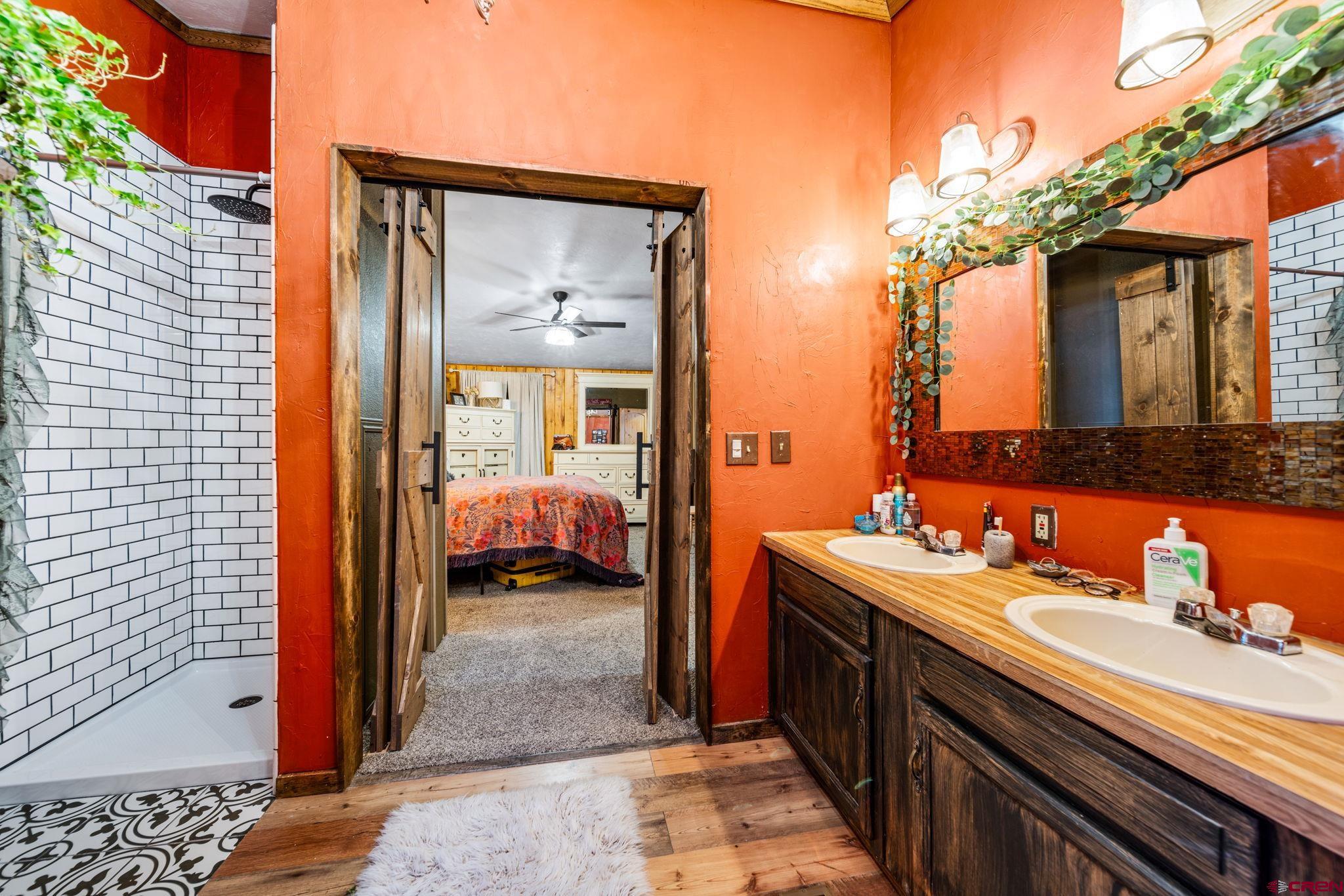 1118 Durango Road Durango, CO 81301 - Photo 16 of 32 a en suite bathroom with a sink and a mirror