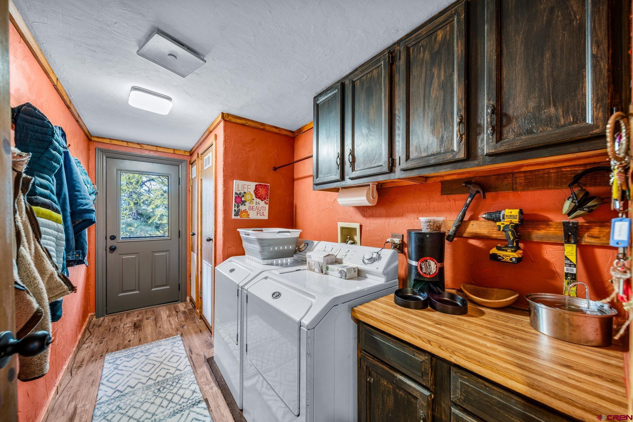 1118 Durango Road Durango, CO 81301 - Photo 19 of 32 a storage room with wooden floor washer and dryer