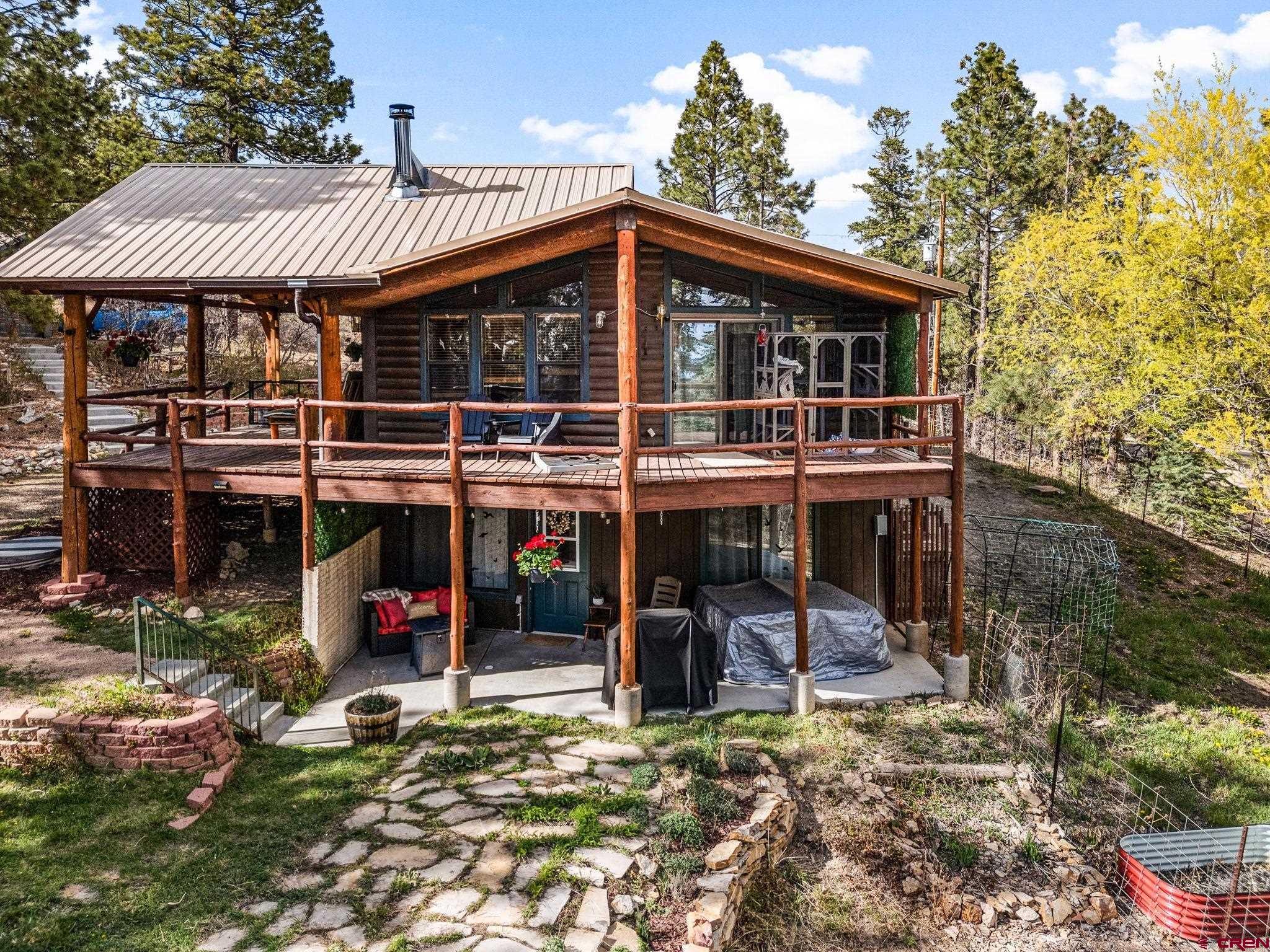 1118 Durango Road Durango, CO 81301 - Photo 2 of 32 a view of a house with backyard porch and sitting area