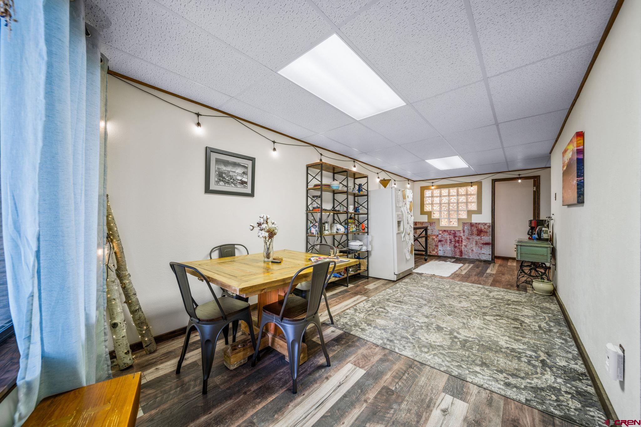 1118 Durango Road Durango, CO 81301 - Photo 29 of 32 a view of a dining room with furniture and window