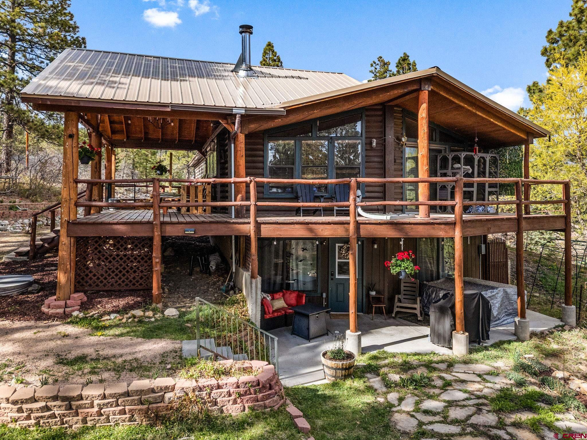 1118 Durango Road Durango, CO 81301 - Photo 5 of 32 a view of a chairs and table in the patio and a fire pit