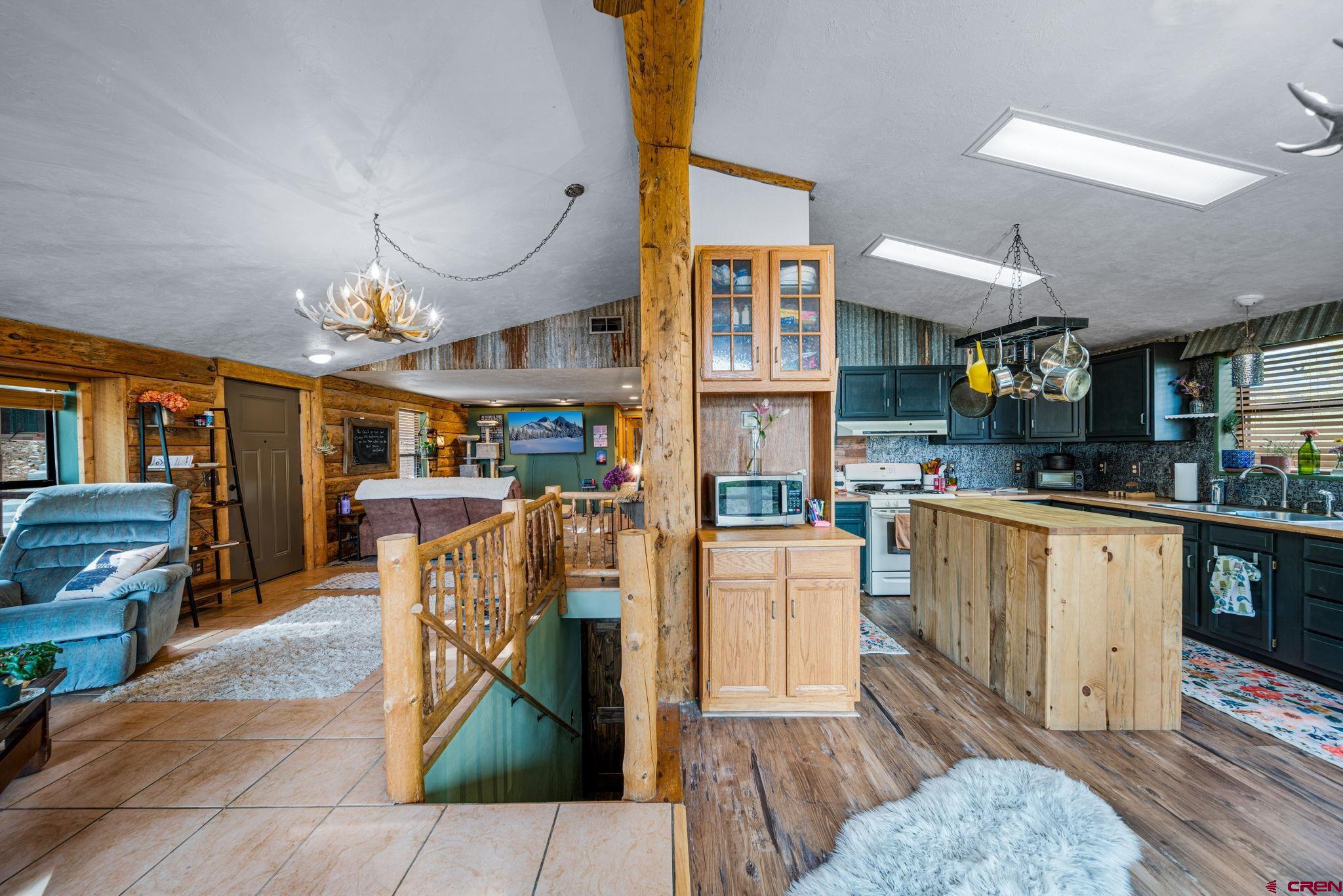 1118 Durango Road Durango, CO 81301 - Photo 9 of 32 a living room with lots of furniture and kitchen view