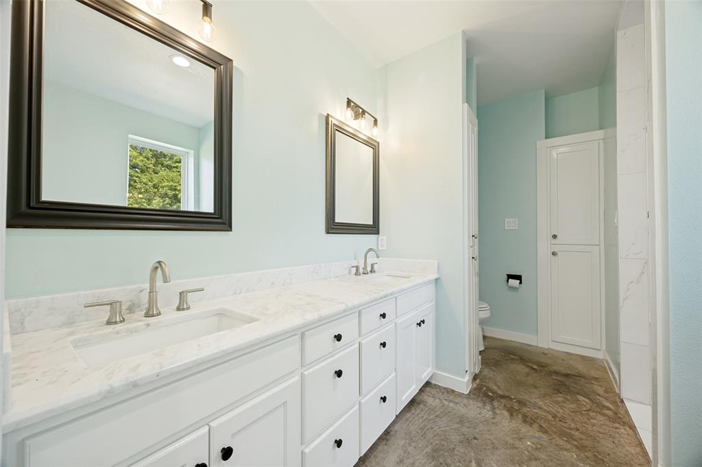 822 Private Road 7370 Point, TX 75472 - Photo 22 of 30 Dual vanity with integral sinks and white stone-finish countertops