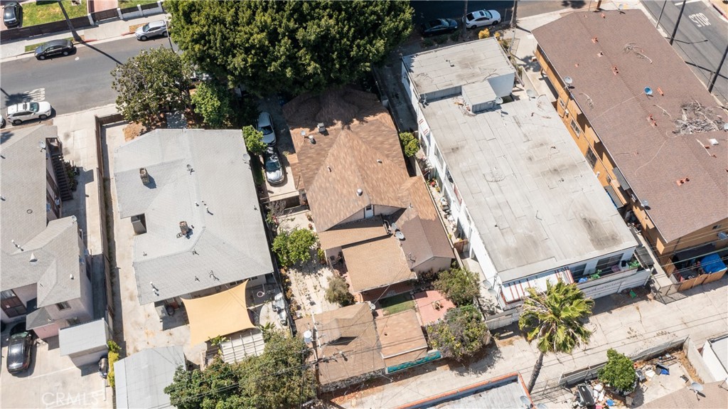 142 North Vendome Street Los Angeles, CA 90026 - Photo 1 of 33 an aerial view of residential house with outdoor space and parking