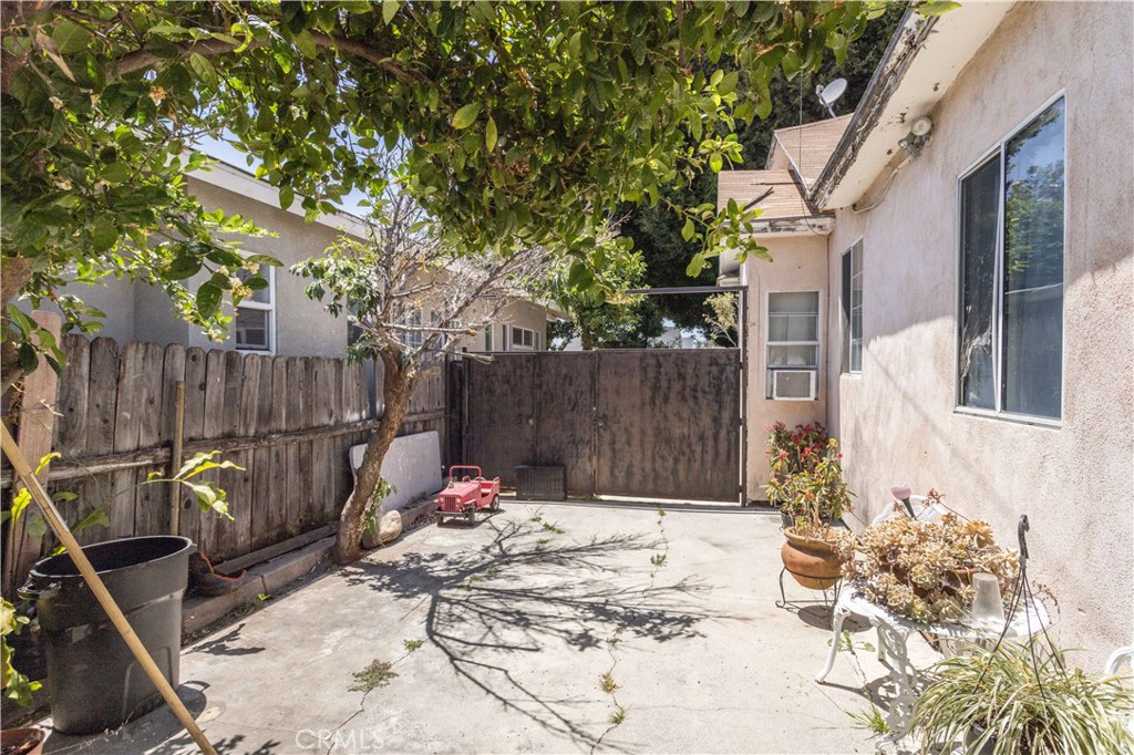 142 North Vendome Street Los Angeles, CA 90026 - Photo 12 of 33 a view of a backyard with a tree