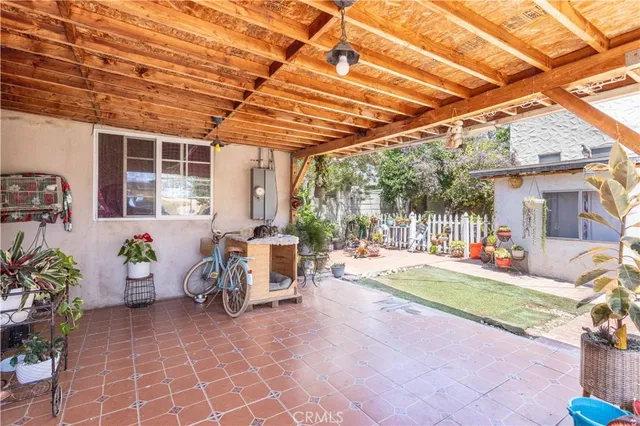 a front view of a house with sitting area