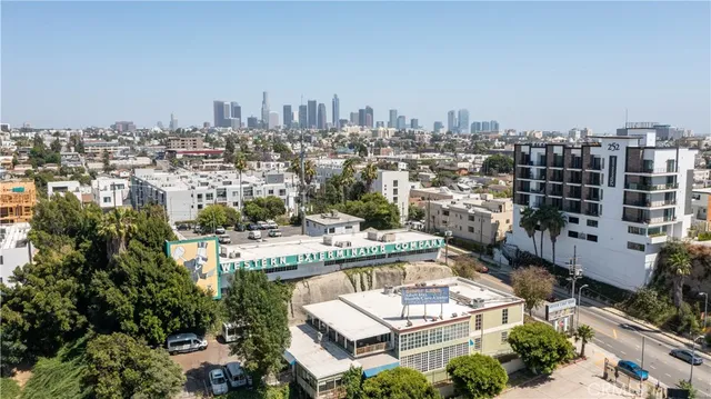 an aerial view of a residential building with an outdoor space