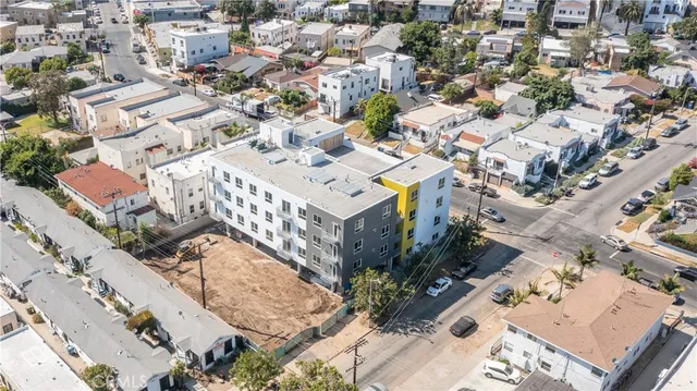 an aerial view of a residential houses with outdoor space