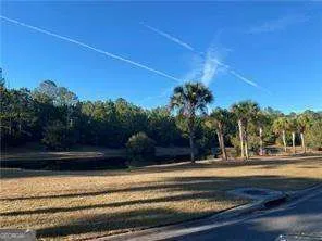 a view of fountain in front of a house