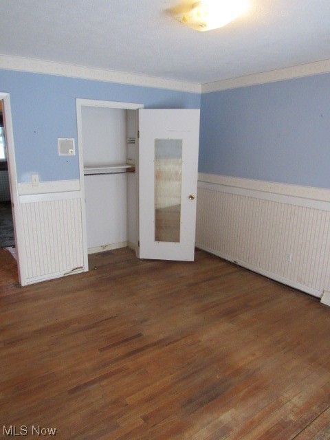 3102 State Road Vermilion, OH 44089 - Photo 41 of 45 Unfurnished bedroom with dark hardwood / wood-style floors, a closet, and crown molding