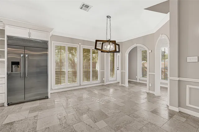 a view of empty room with windows