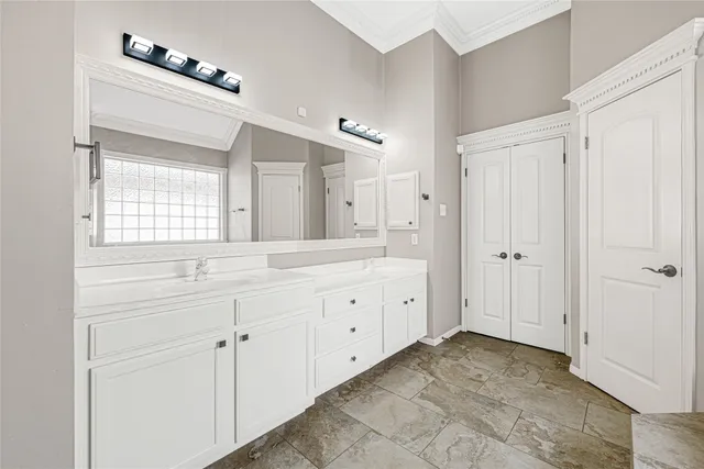 a spacious bathroom with a granite countertop sink mirror and a