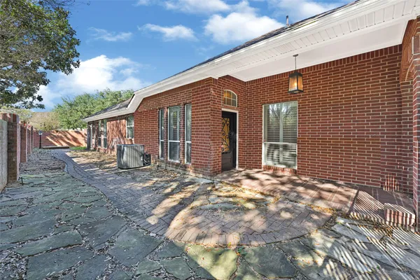 a view of a house with backyard and porch