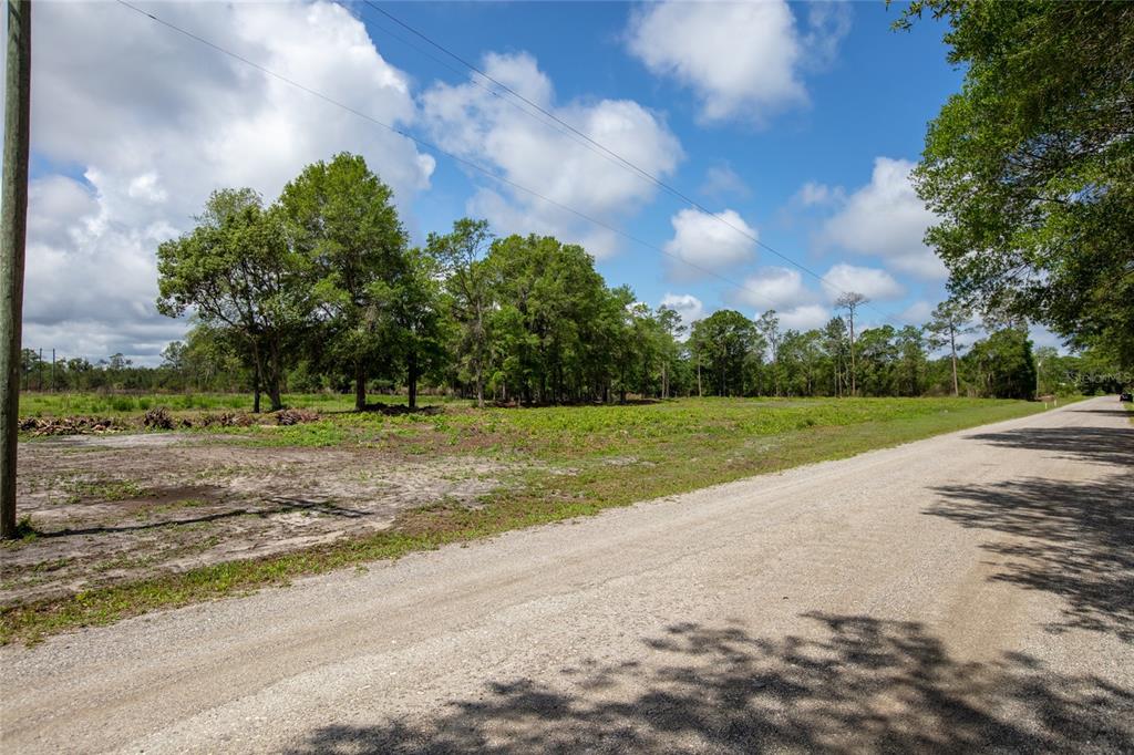 Northwest 185th Street Starke, FL 32091 - Photo 16 of 19 a view of a house with a big yard