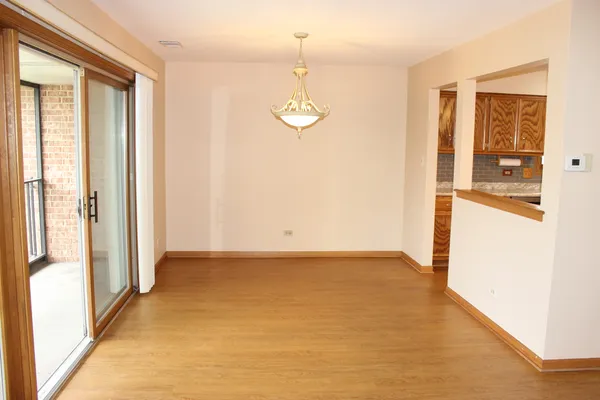 a kitchen with stainless steel appliances granite countertop a sink stove microwave and refrigerator