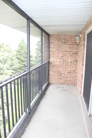 a view of a glass door and a porch