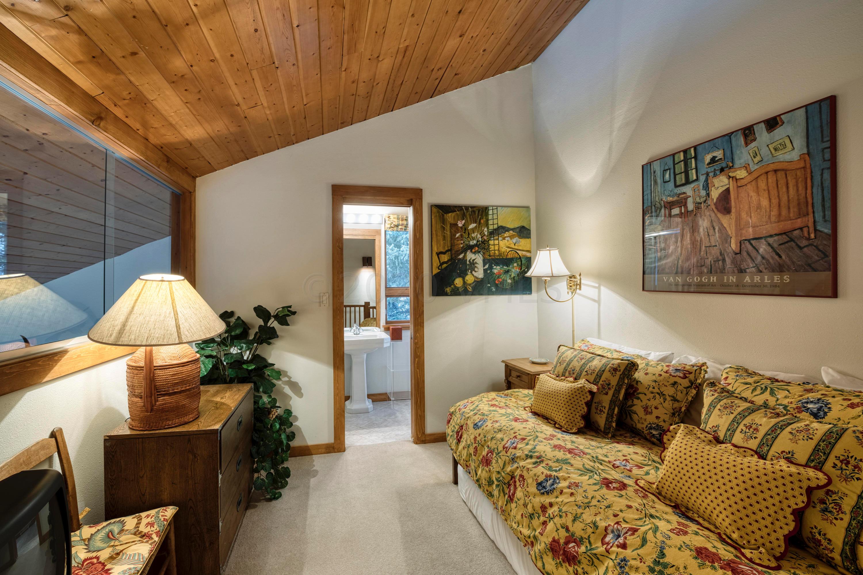 600 Vail Valley Drive, Unit E 9 Vail, CO 81657 - Photo 13 of 26 a bedroom with furniture and a bed