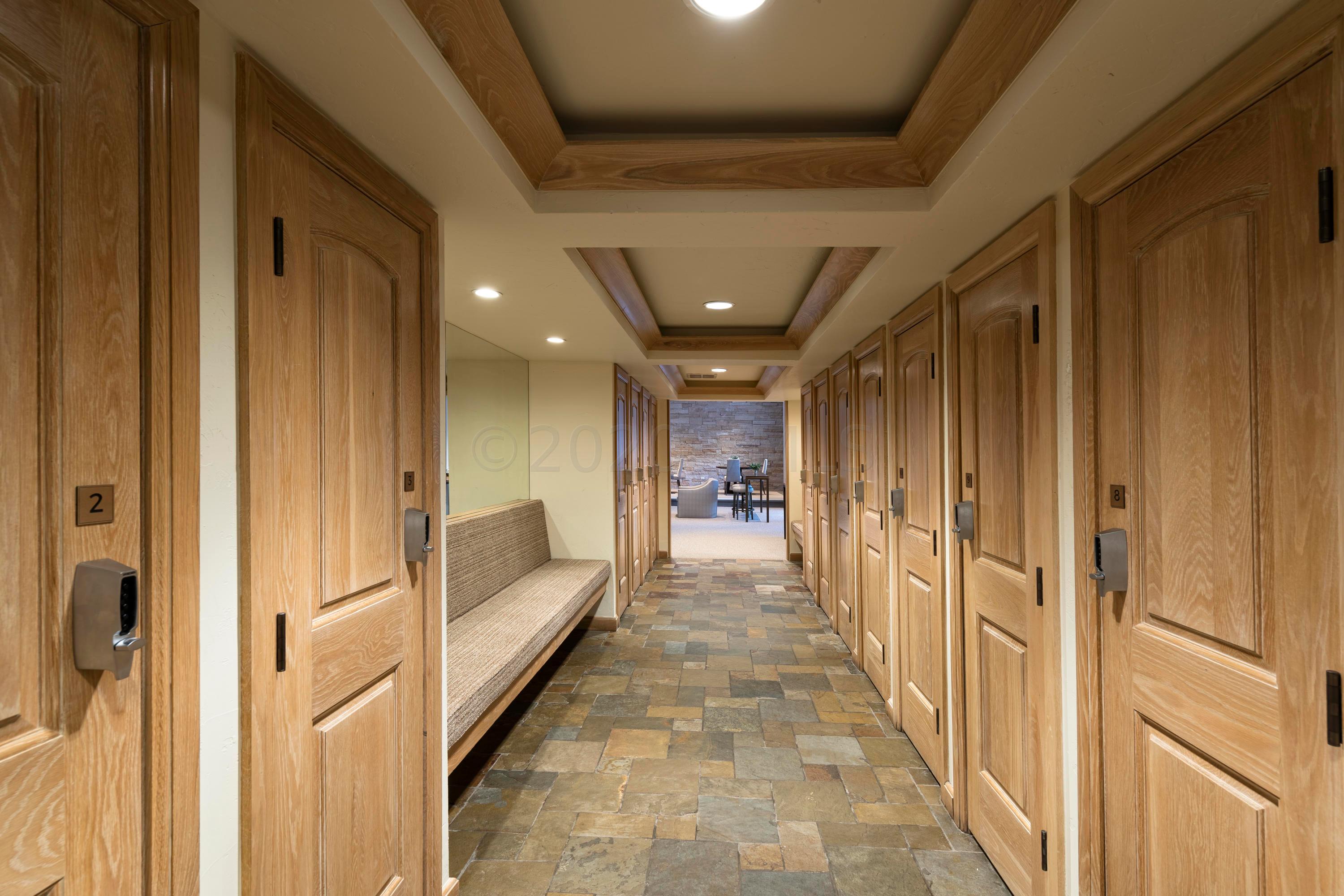 600 Vail Valley Drive, Unit E 9 Vail, CO 81657 - Photo 20 of 26 a hallway with white doors wooden floor and stair