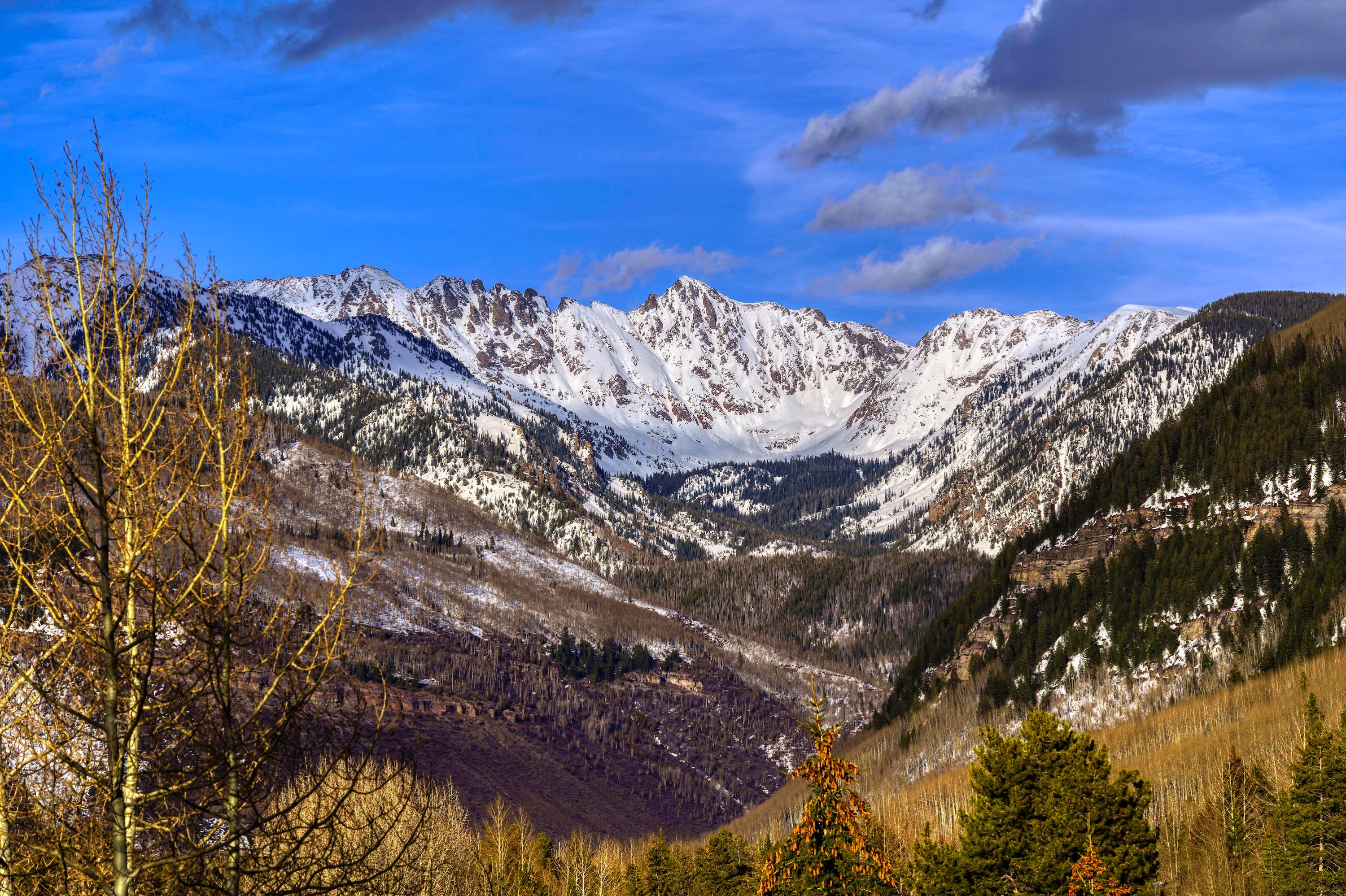 600 Vail Valley Drive, Unit E 9 Vail, CO 81657 - Photo 3 of 26 a view of a large building with lots of trees