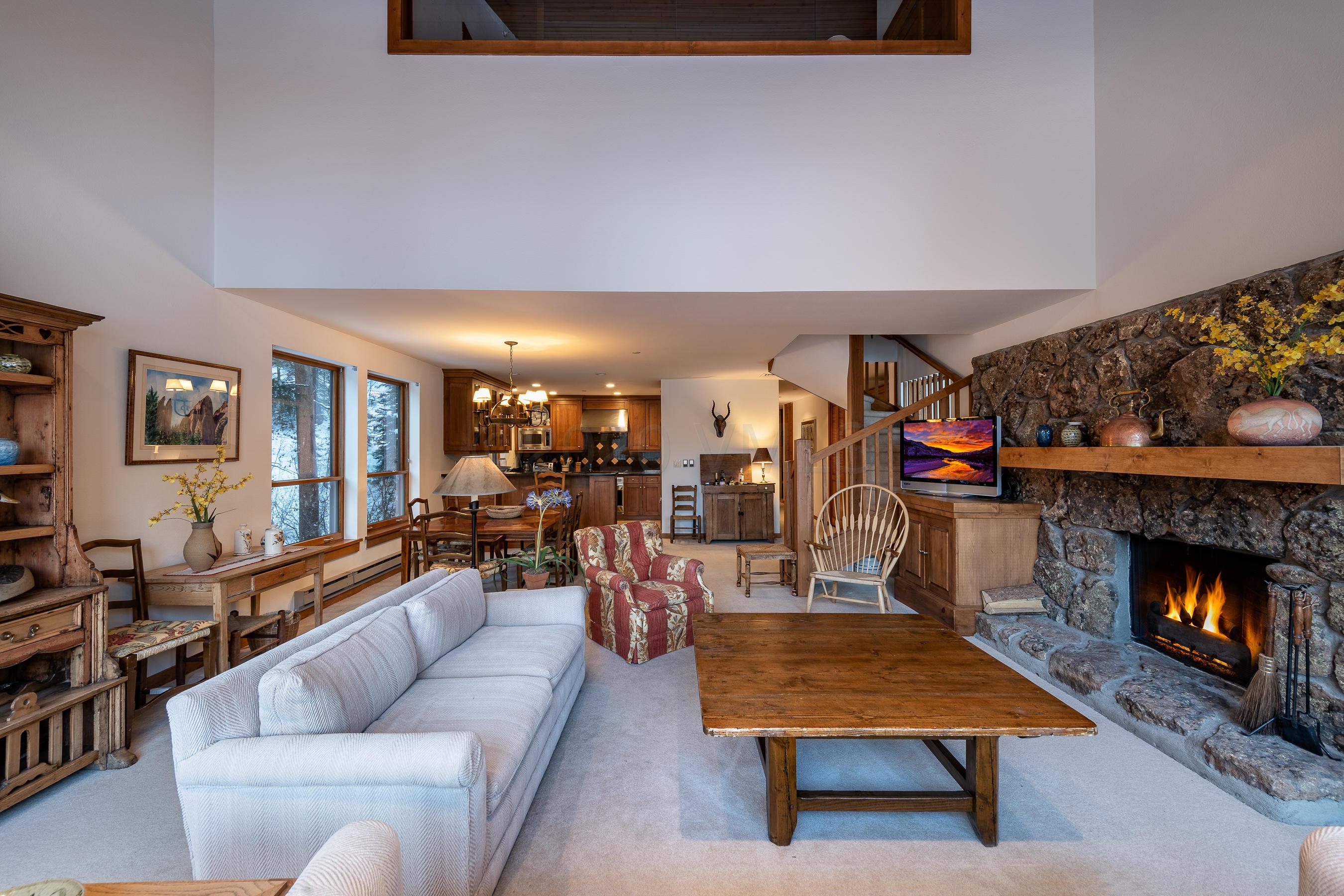 600 Vail Valley Drive, Unit E 9 Vail, CO 81657 - Photo 4 of 26 a living room with furniture and a fireplace