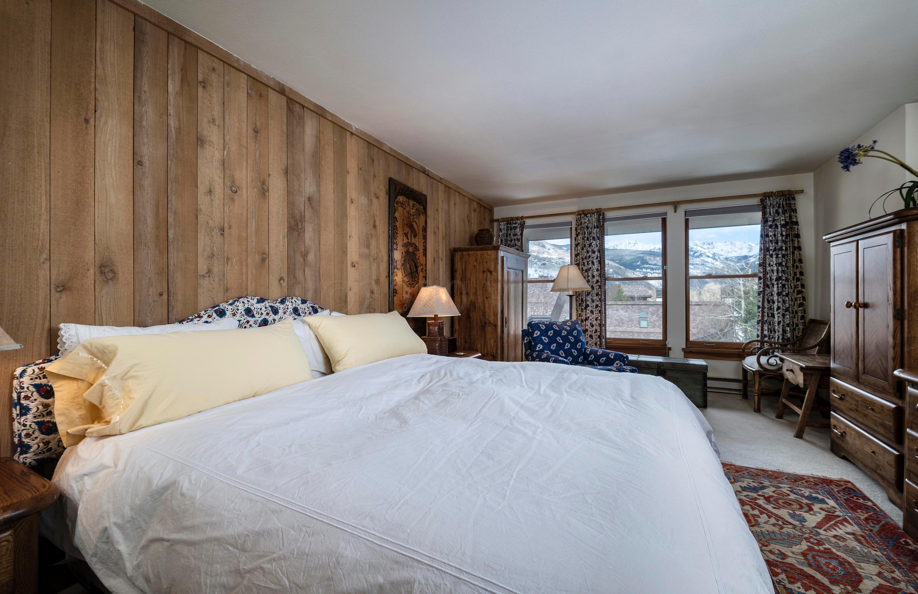 600 Vail Valley Drive, Unit E 9 Vail, CO 81657 - Photo 6 of 26 a bed room with a bed and large windows