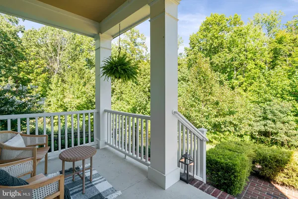 a view of a patio with table and chairs and potted plants
