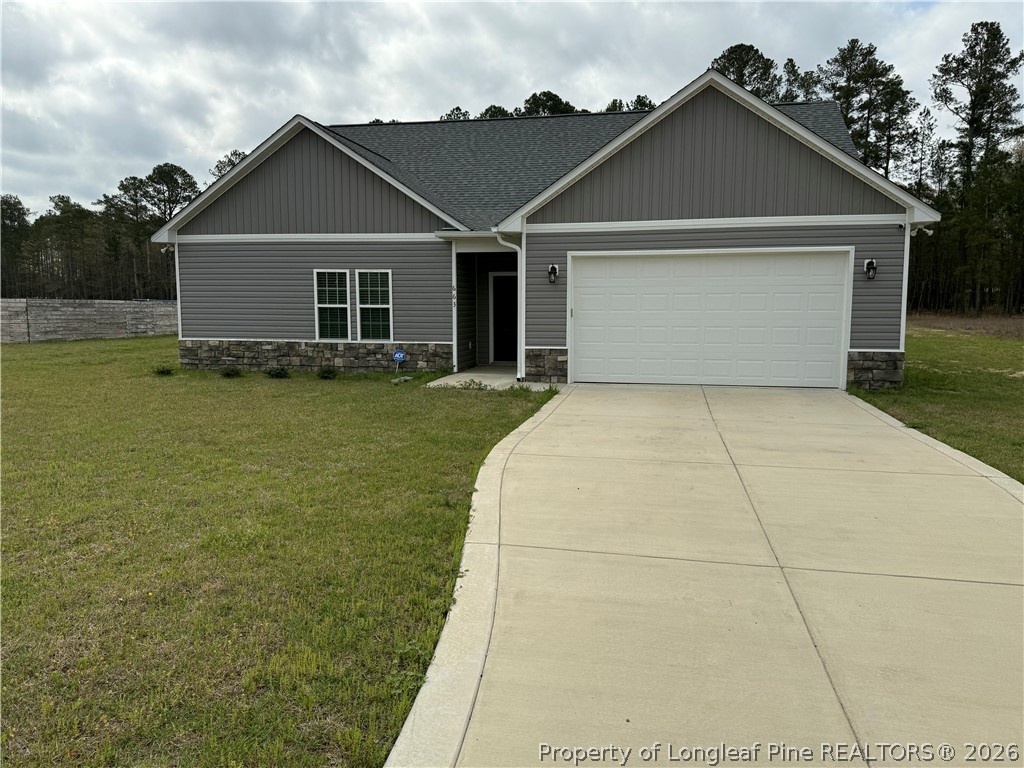 663 Hector McNeill Road Raeford, NC 28376 - Photo 2 of 16 front view of a house with a yard